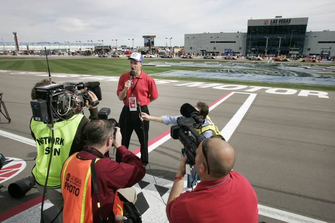 As grand marshal, UNLV basketball coach Lon Kruger makes the call "Gentlemen, start you engines" before the start of the Nationwide Series Sam's Town 300 on Saturday.