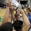 The Lake Mead Christian Academy boys basketball team hoists the class 1A State Champion plaque after defeating the Pahranagat Valley Panthers at the Orleans Arena on Saturday afternoon.