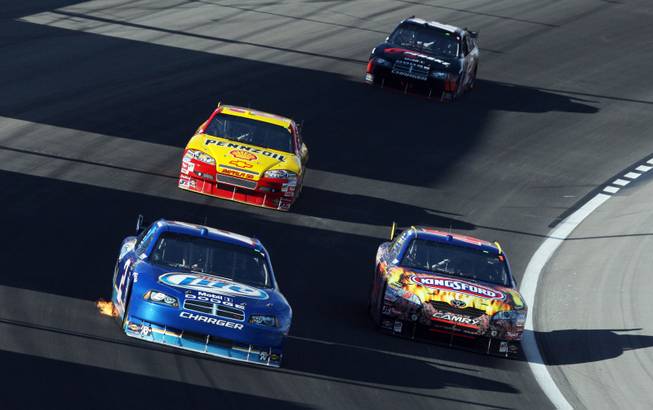 Kurt Busch (2), front left, and Marcos Ambrose (47), right, race around turn two during the 2009 Shelby 427 NASCAR Sprint Cup Series race at the Las Vegas Motor Speedway on Sunday. Behind them are Kevin Harvick (29) and David Stremme (12). 
