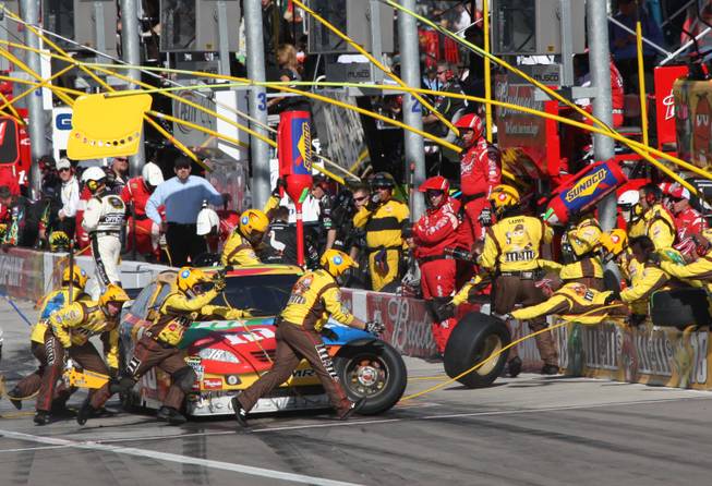 Las Vegas native Kyle Busch (18) makes a pit stop during the 2009 Shelby 427 NASCAR Sprint Cup Series race at the Las Vegas Motor Speedway on Sunday.