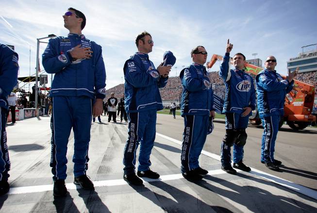Kurt Busch's team stands for the National Anthem at the Shelby 427 Sprint Cup Race at the Las Vegas Motor Speedway on Sunday.