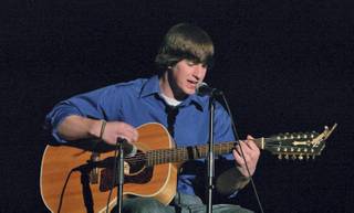 Sean Bowen jams out on the acoustic guitar during the Boulder City High school talent show Thursday.