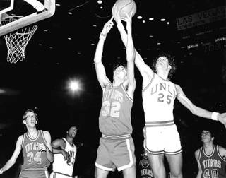 Glen Gondrezick fights for a rebound. Gondo, a key member of the Hardway Eight, was a gritty player who played a number of roles for the Rebels. 