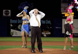 Mayor Oscar Goodman reacts after he botches a pitch before the White Sox versus Cubs exhibition game at Cashman Field in Las Vegas Wednesday.