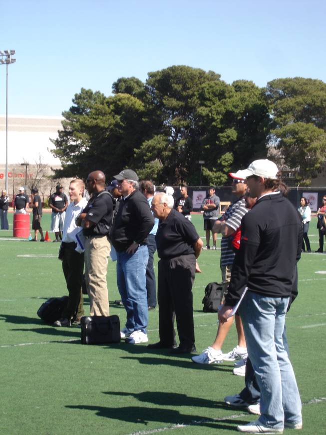 Scouts from 12 NFL franchises look on during the running portion of UNLV's annual Pro Day on Thursday at Rebel Park.