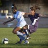 Centennial High School senior Ashley Mosley, left, leads the way with the ball as Shadow Ridge's Kelsey Kurth comes up from behind during the Sunset Regional semifinals at the Bettye Wilson Soccer Complex on Thursday.
                               