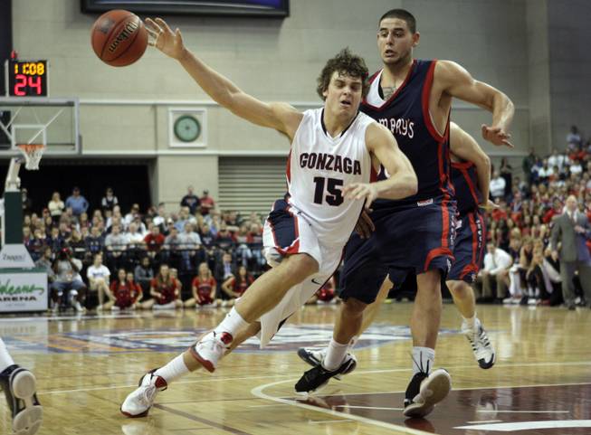 Gonzaga's Matt Bouldin (15) loses control of the ball as he tries to drive by St. Mary's Omar Samhan (50) during the 2010 West Coast Conference men's basketball championship at the Orleans Monday, March 8, 2010. 