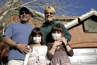 The Cerda family -- Chuck, Terri, Maggie and Molly -- stand in front of their home on Tuesday, which will be torn down and replaced as part of ABC's 