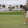 Green Valley junior Ryan Green practices on the putting green at Legacy Golf Club.