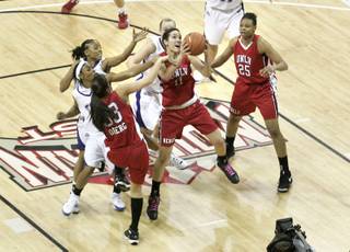 UNLV guard Jamie Smith drives to the hoop against TCU at the Mountain West Conference Basketball Championships Wednesday. UNLV won 84-75 and will advance to play San Diego State on Friday. Smith finished the game with her second double double in as many days.