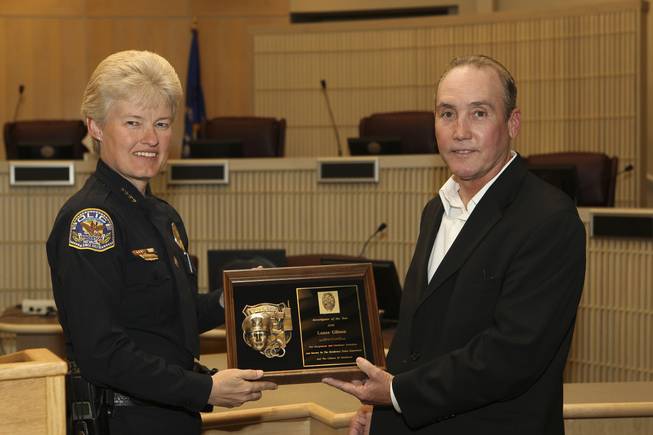 In recognition of 20 years of dedication and hard work, Detective Lance Gibson receives the Investigator of the Year Award from Henderson Police Chief Jutta Chambers Wednesday during the 6th Annual Commendation Award Ceremony.  Currently assigned to Intel, Gibson continues to provide outstanding leadership and insight as a senior investigator and going beyond the call of duty for the City of Henderson and the citizens of the community.