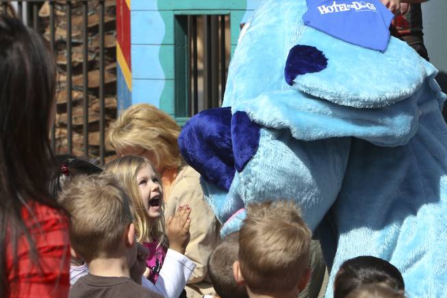 Kennedy Alexander, 3, smiles with surprise as Blue's Clues appears during storytime Wednesday in Town Square plaza in celebration of National Reading Month.