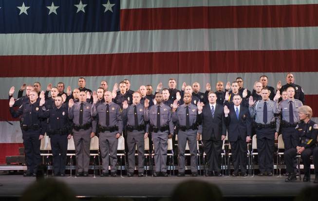 Graduating cadets are sworn in during the graduation ceremony of the Southern Desert Regional Police Academy Thursday at the College of Southern Nevada Cheyenne Campus.