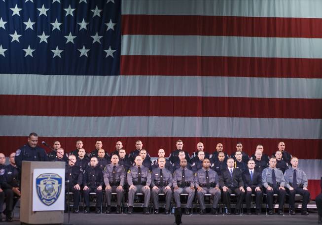 Graduating cadets sit at attention during the graduation ceremony of the Southern Desert Regional Police Academy Thursday at the College of Southern Nevada Cheyenne Campus.