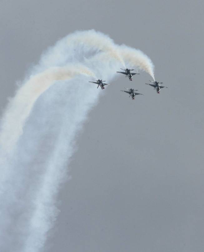 F-16 jets from the U.S. Air Force Air Demonstration Squadron Thunderbirds perform during their annual approval show Thursday at Nellis Air Force Base.
