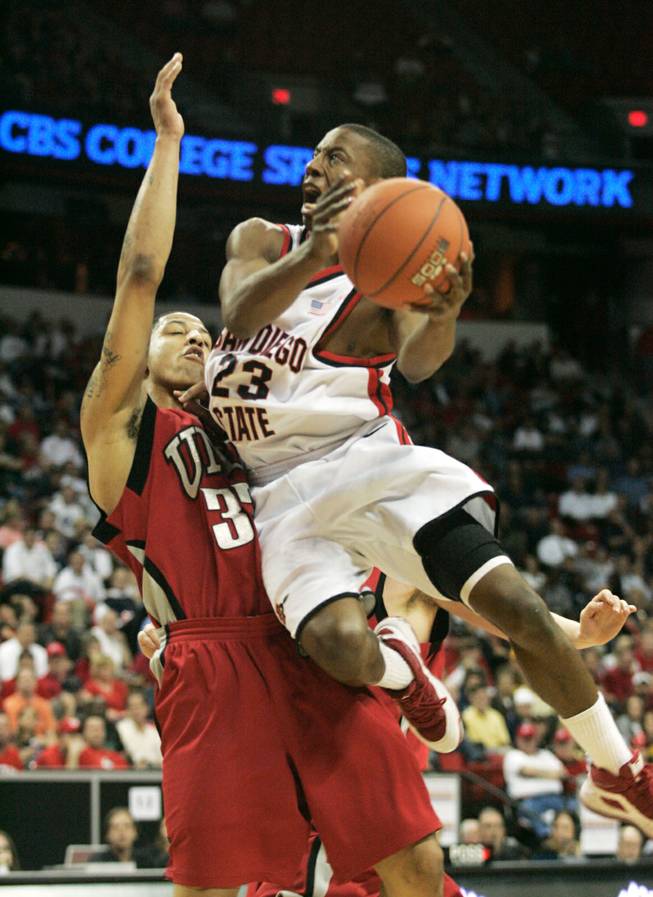 San Diego State's D.J. Gay sails past UNLV guard Tre'Von Willis during their game at the Mountain West Conference tournament last March.