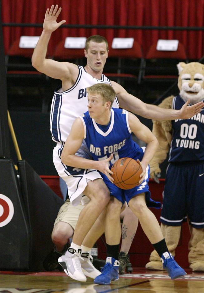 Air Force's Grant Parker tries to get around BYU forward Chris Miles during the first half of their game at the Mountain West Conference Basketball Championships Thursday, March 12, 2009.  SAM MORRIS / LAS VEGAS SUN