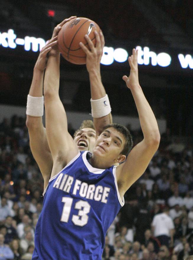 Air Force teammates Trevor Noonan, front, and Andrew Henke grab a rebound together during their game against BYU at the Mountain West Conference Basketball Championships Thursday, March 12, 2009.  SAM MORRIS / LAS VEGAS SUN