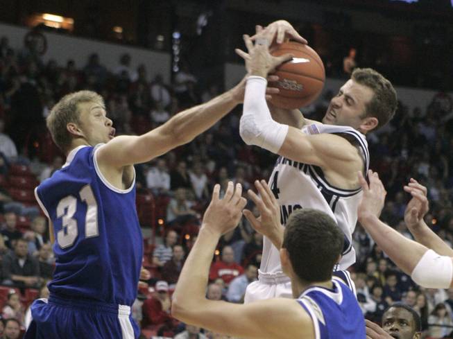 Air Force forward Matt Holland blocks a shot attempt by BYU guard Jackson Emery during their game at the Mountain West Conference Basketball Championships Thursday, March 12, 2009.  SAM MORRIS / LAS VEGAS SUN
