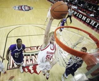 Utah center Luke Nevill dunks against TCU at the Mountain West Conference Basketball Championships Thursday, March 12, 2009.  Utah won the game 61-58 on a last-second three point shot. 