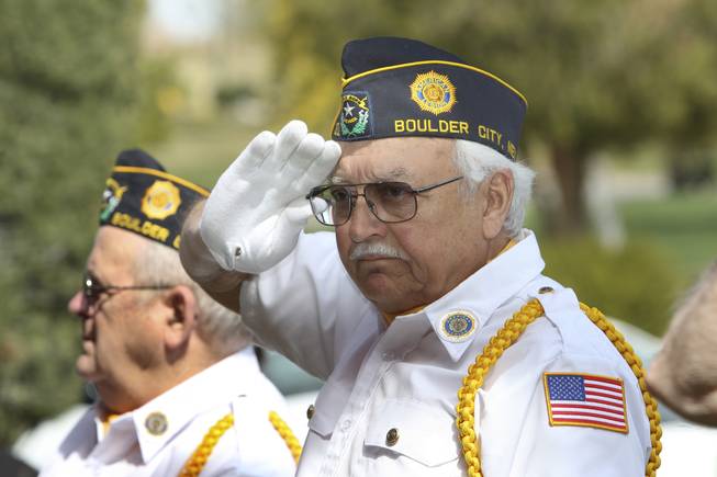 Jack Belleau, of the American Legion Post 31 Color Guard, salutes during the pledge of allegiance during the installment ceremony of Postmaster Shirley Roland Thursday in Boulder City.