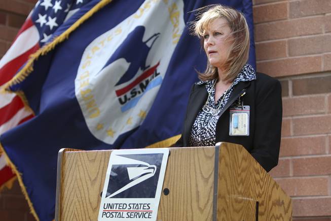 Following her swearing-in, Postmaster Shirley Roland speaks with emotion about her commitment to serving Boulder City as the new postmaster Thursday during the installment ceremony.