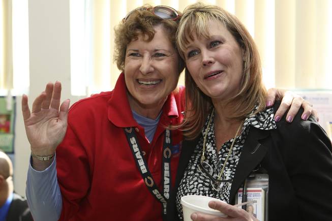 Postmaster Shirley Roland receives a congratulatory hug from colleague and friend, Debbie Letts, during her installment ceremony reception Thursday in Boulder City.