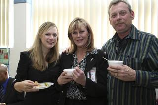 Postmaster Shirley Roland poses for a photograph with her husband, Mike, and daughter, Leslie, left, during her installment ceremony reception Thursday in Boulder City.