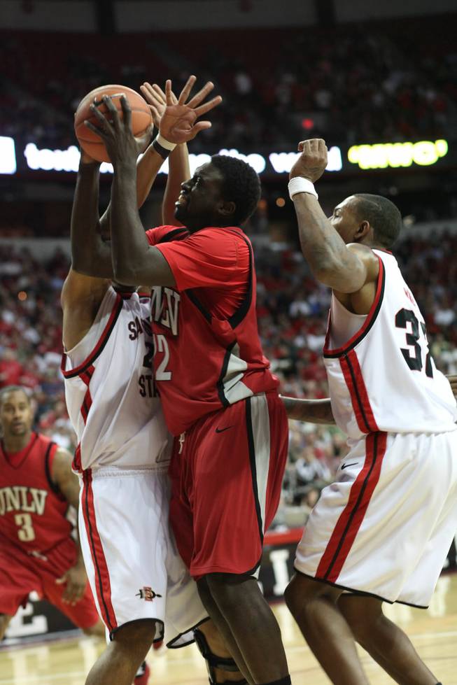 Brice Massamba gets fouled as he takes it up for a layup as UNLV takes on San Diego State on Thursday in the Mountain West Conference tournament at the Thomas & Mack Center. The Rebels fell for the third time this season to the Aztecs, 71-57.