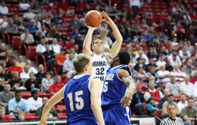 Jimmer Fredette shoots it over the outstretched arms of the defense as Air Force takes on BYU last March in the Mountain West Conference tournament at the Thomas & Mack Center.
