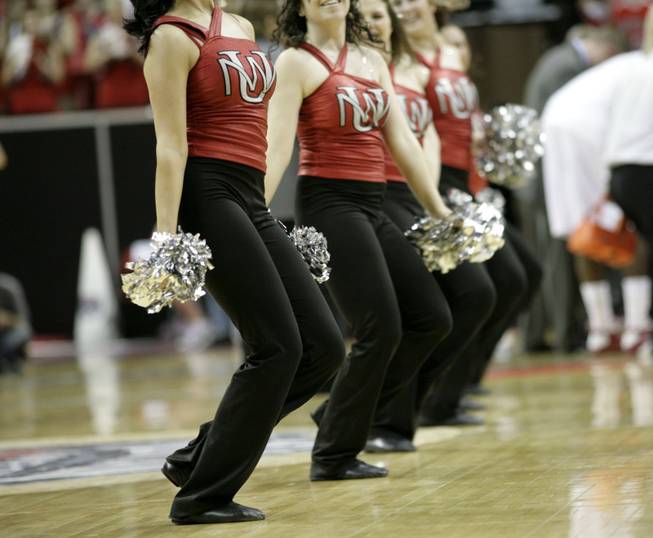 The New Mexico cheerleaders perform during a timeout as New Mexico takes on Wyoming on Thursday in the Mountain West Conference tournament at the Thomas & Mack Center. 