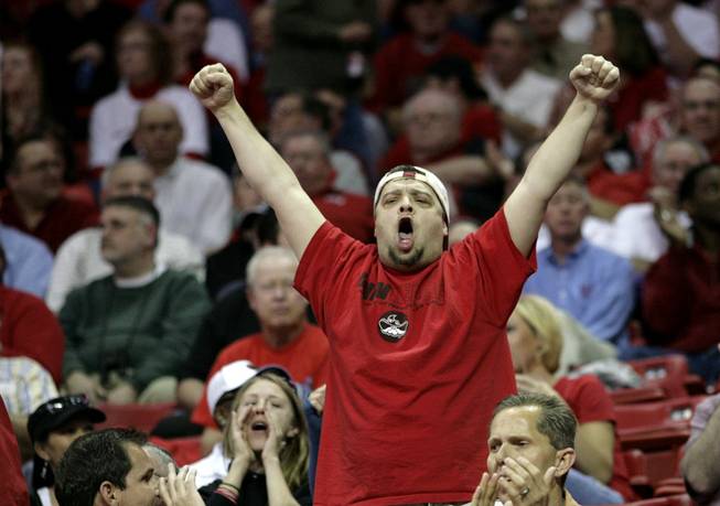 A Rebal fan cheers as  UNLV takes on San Diego St. on Thursday in the Mountain West Conference tournament at the Thomas & Mack Center. The Rebels fall for the third time this season to the Aztecs 71-57.