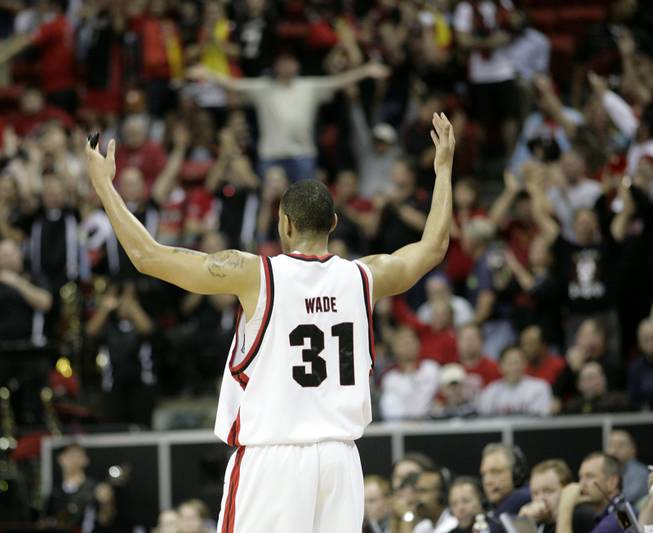 Lorrenzo Wade throws his hands in the air in celebration as UNLV takes on San Diego State in the Mountain West Conference tournament at the Thomas & Mack Center. The Rebels fell for the third time this season to the Aztecs, 71-57.