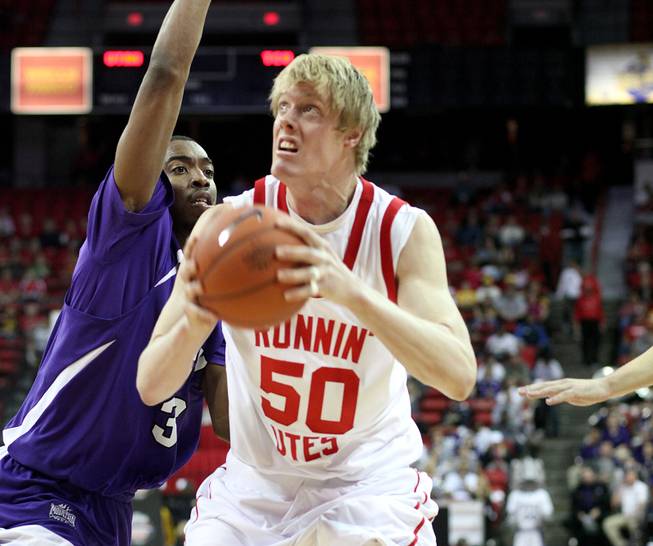 Luke Nevill looks to the basket as Utah takes on TCU on Thursday in the Mountain West Conference tournament at the Thomas & Mack Center. Utah eeked out the win 61-58.