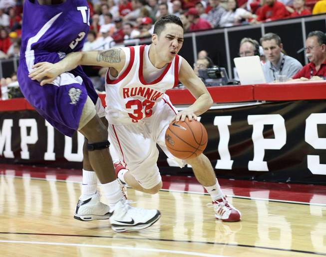 Tyler Kepkay turns the corner on the defense as Utah takes on TCU on Thursday in the Mountain West Conference tournament at the Thomas & Mack Center. Utah eeked out the win 61-58.