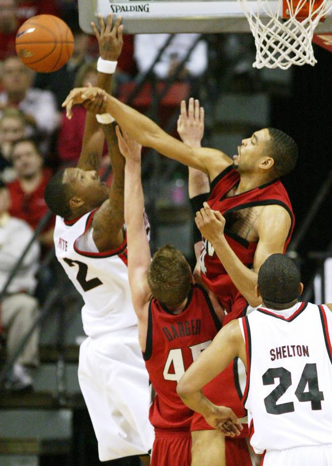 UNLV guard Rene Rougeau blocks a shot by San Diego State forward Billy White at the Mountain West Conference Basketball Championships Thursday, March 12, 2009.  San Diego State won the game 71-57.