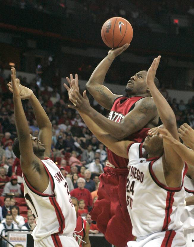 UNLV guard Wink Adams puts up a shot in traffic against San Diego State at the Mountain West Conference Basketball Championships Thursday, March 12, 2009.  While Adams had a game high 26 points, San Diego State won the game 71-57. 