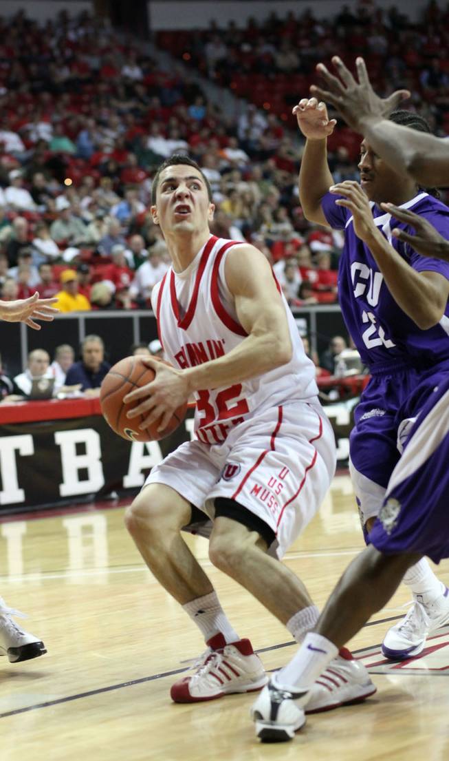 Tyler Kepkay is met by defensive players as Utah takes on TCU Thursday, March 12, 2009 in the Mountain West Conference tournament at the Thomas & Mack Center. 