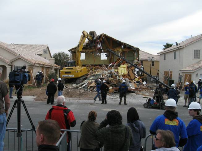A crew tears down the Cerda family's house for ABC's "Extreme Makeover: Home Edition" filming in Las Vegas this week.