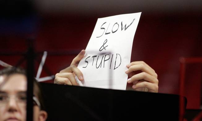 A member of the UNLV band holds up a sign intended to make fun of the Texas Christian University women's basketball team Wednesday during the quarterfinals of the Mountain West Championship.