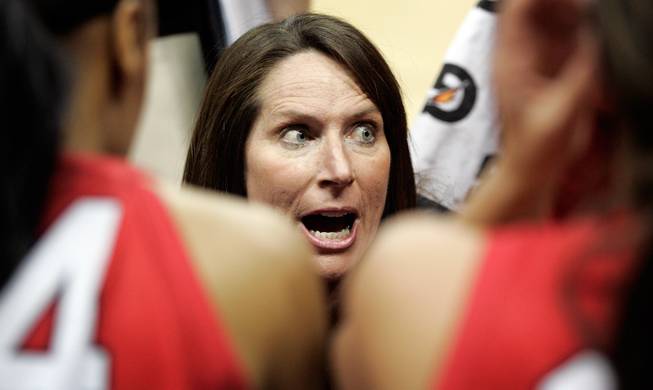  UNLV head coach Kathy Olivier talks to the team during a time out Wednesday during the game against Texas Christian University during the quarterfinals of the Mountain West Championship at the Thomas & Mack Center.