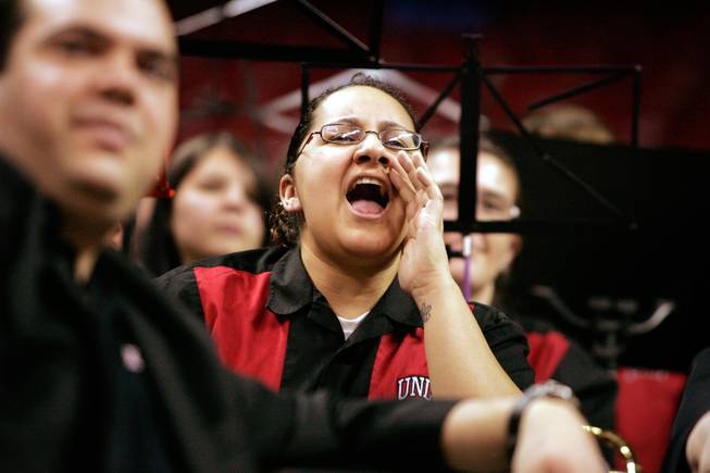 UNLV band member Samantha Bravo cheers for the UNLV women's basketball team Wednesday against Texas Christian University during the quarterfinals of the Mountain West Championship at the Thomas & Mack Center.