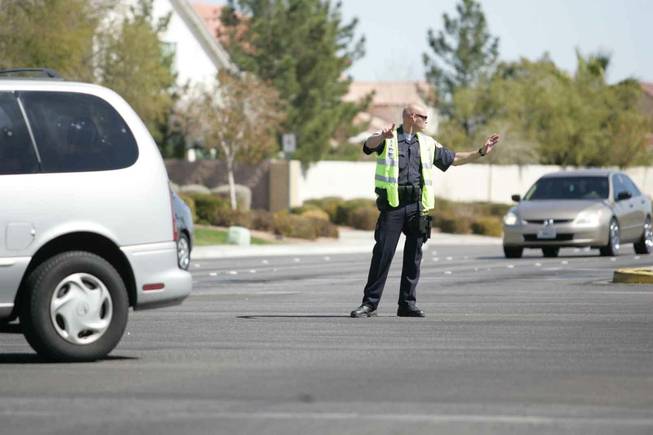 Henderson police direct traffic at Pecos and Windmill on Saturday.