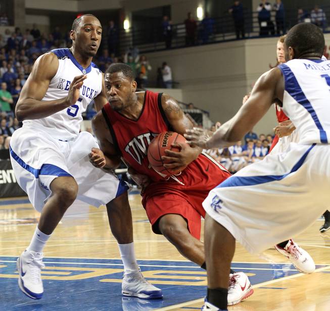 Wink Adams takes it against the defense as UNLV takes on the Wildcats in Lexington, Ky., in the first round of the NIT. 