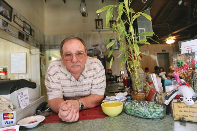 Former Boulder City High football player and coach Ray Thurston poses at his diner.
