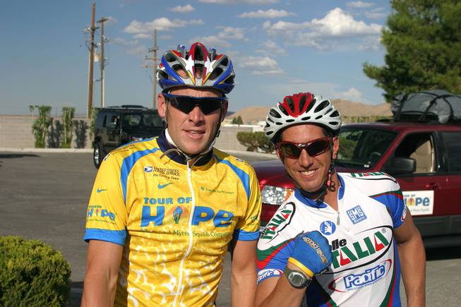 Ryan Pretner is shown with Lance Armstrong during a fundrasing event. Pretner, 37, suffered a fractured skull and was in a coma for more than 60 days after he was struck on the back of the head by a truck's side mirror Jan. 12 while he was cycling on St. Rose Parkway. 