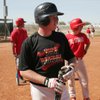 Southeast Technical and Career Center senior Chris Sambol takes a break during batting practice.