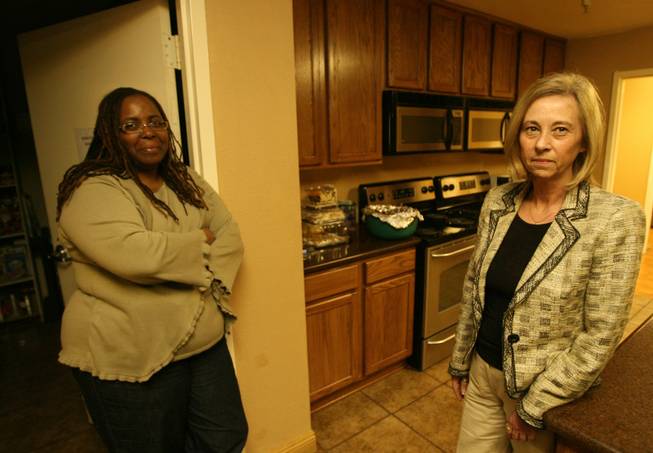 Julie Proctor, right, executive director of S.A.F.E. House, and shelter director Cassandra Wesley in the shelter's kitchen. Shelter workers say that despite an increase in reports of domestic violence, they are worried because shelter population numbers aren't rising at the same rate.