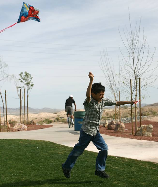 Oscar Toribio, 7, flies his kite during the grand opening of Shadow Rock Park in North Las Vegas Saturday, March 21, 2009.