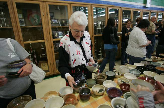 Sally Harviel browses at ceramic bowls during the Empty Bowl benefit luncheon at Green Valley High Saturday, March 21, 2009. Money raised during the event will be used to feed the homeless of Las Vegas. 
